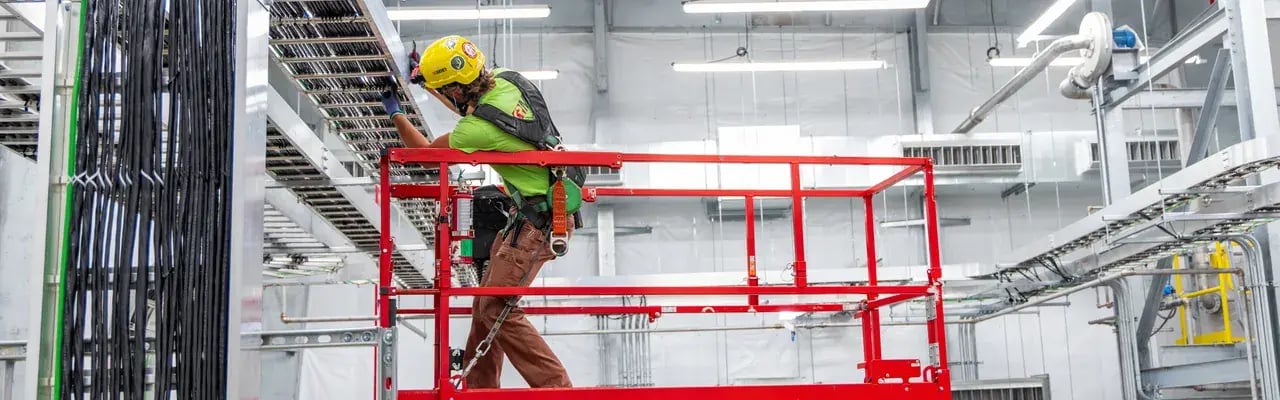 industrial-worker-cable-installation-scissor-lift-1280x400