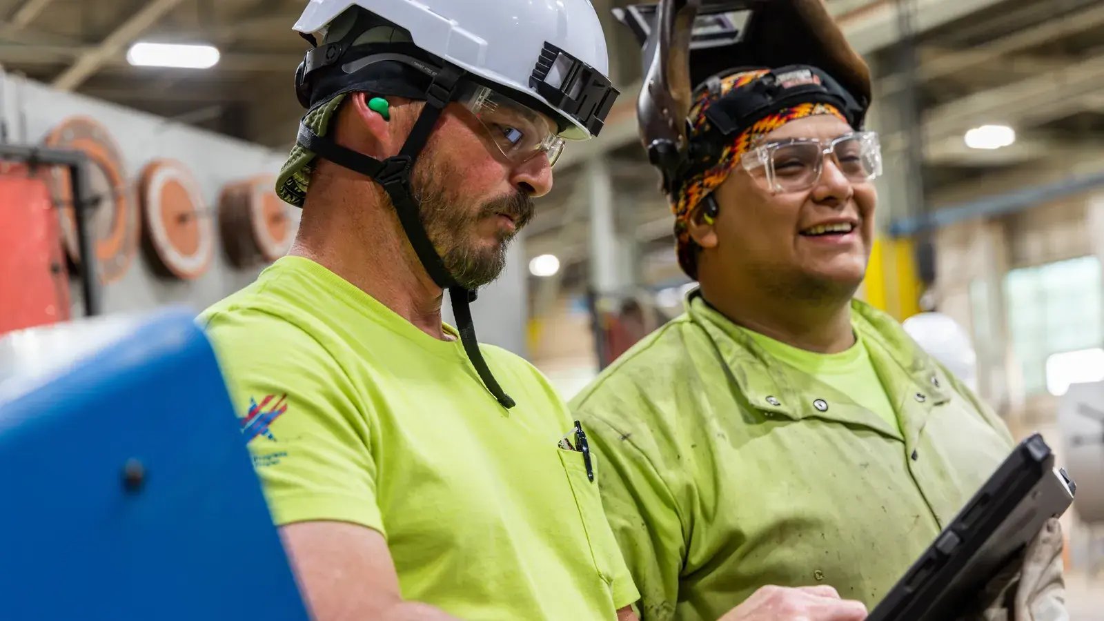 industrial workers collaborating with tablet