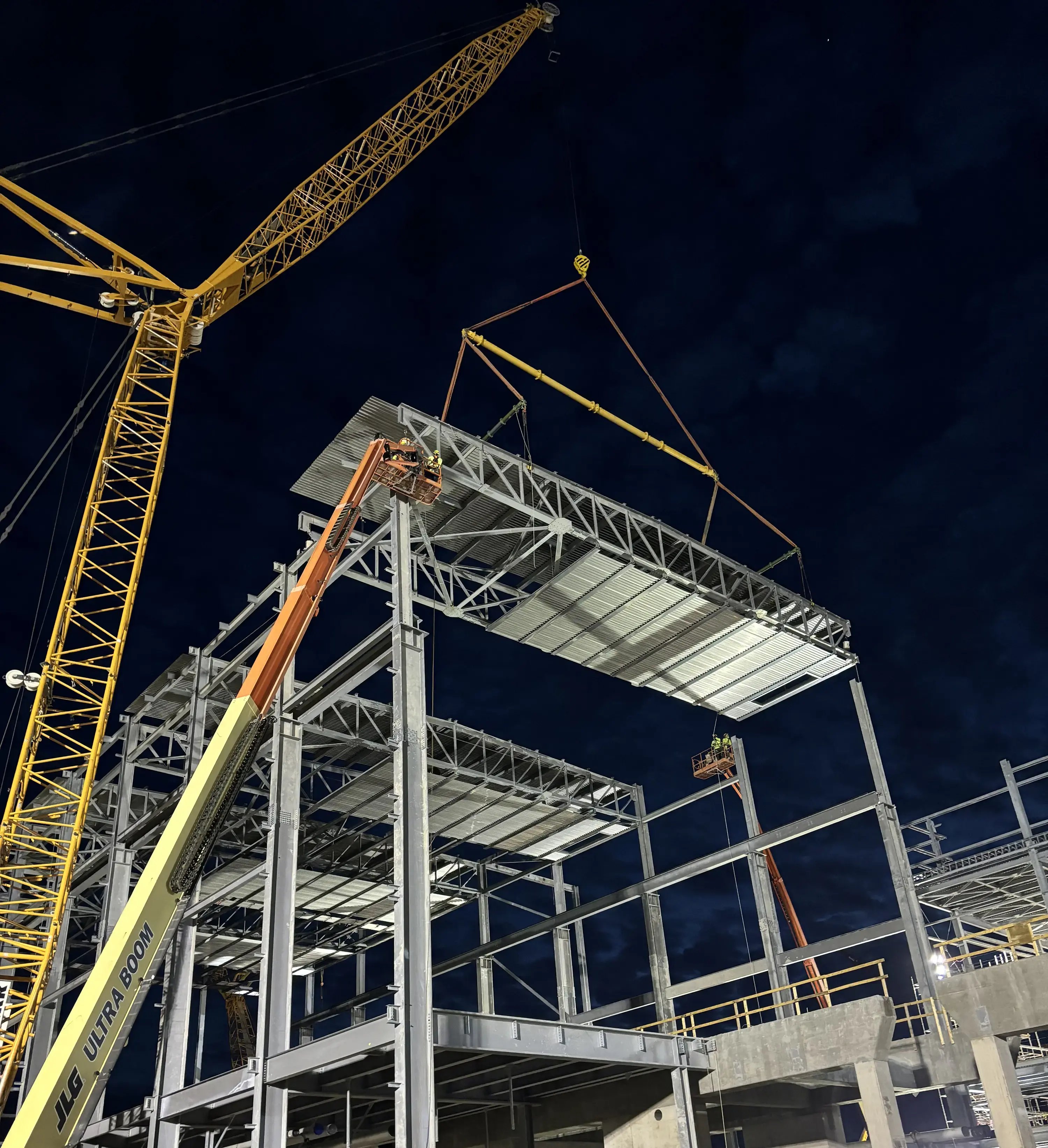 night construction steel structure crane lift